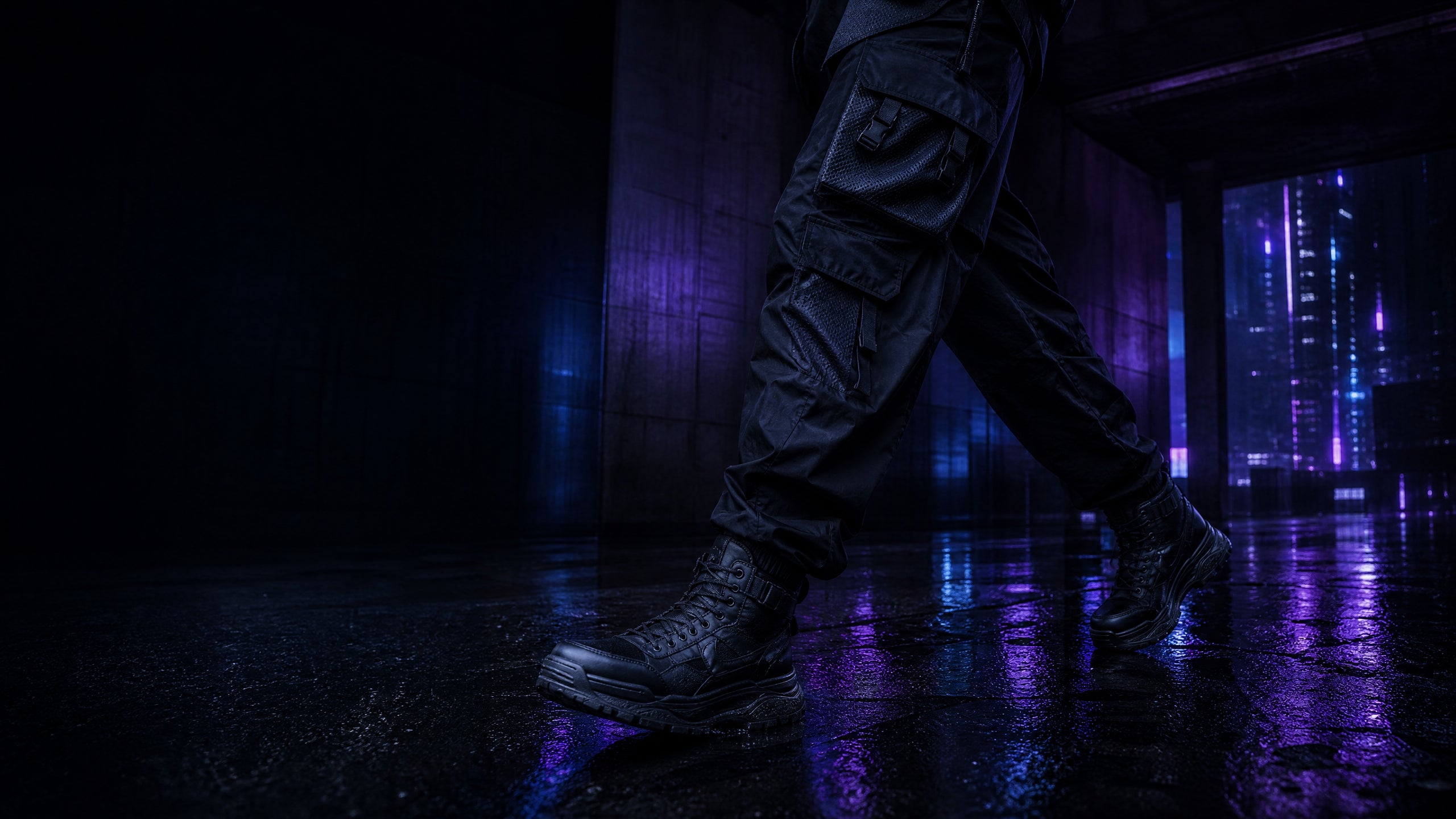 Articulated black cargo pants and high-top footwear stepping across violet-lit wet pavement