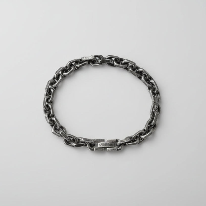Silver chain bracelet on a white background