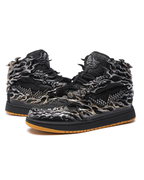 Black high-top sneakers with intricate designs on a white background