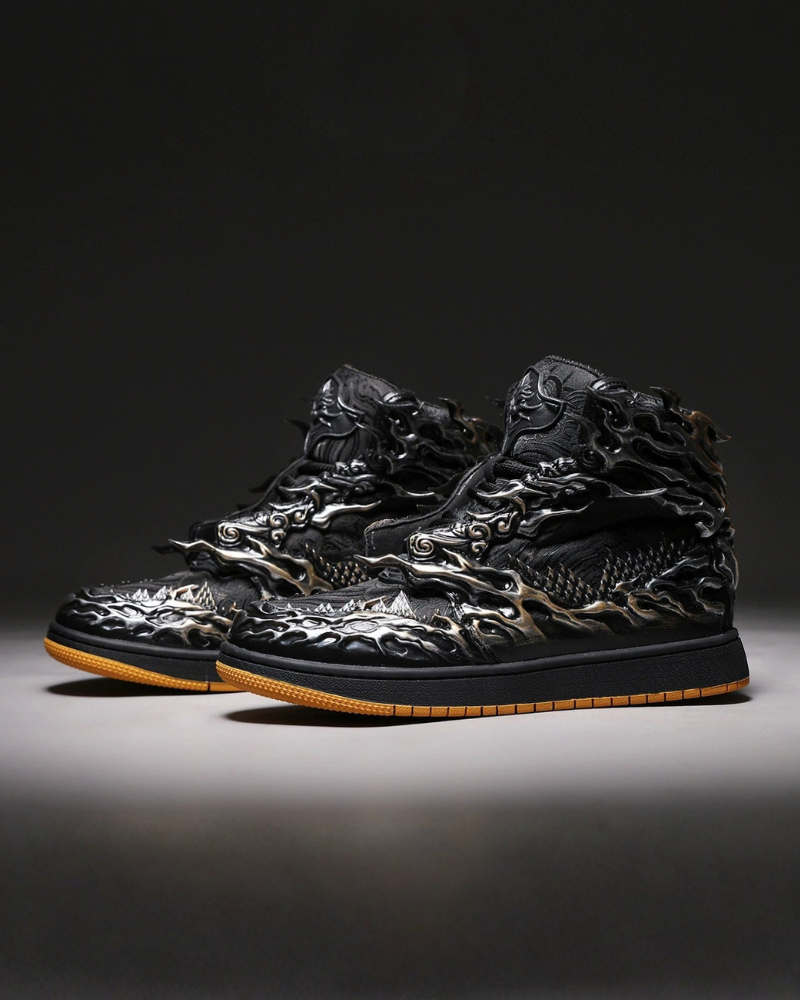 Black high-top sneakers with intricate design on a dark background