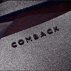 Comback name on the backpack zip up close up image