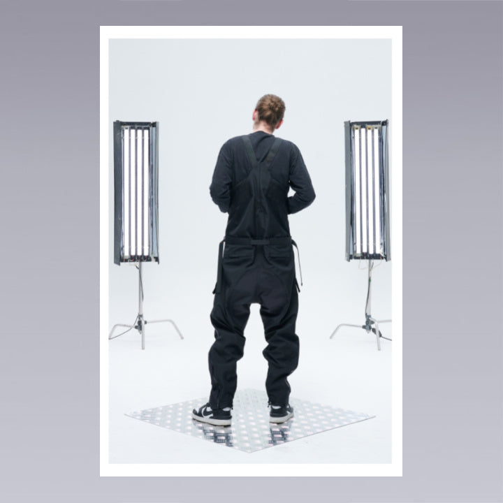 Men standing wearing techwear pants overalls