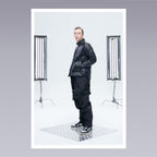 Men standing wearing techwear pants overalls