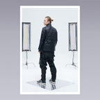 Men standing wearing techwear pants overalls