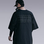 Man wearing THE DARK UNISEX TECHWEAR T-SHIRT