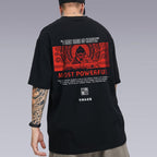 A tattooed Man wearing the UNISEX Kimura Sensei T-SHIRT in Black color