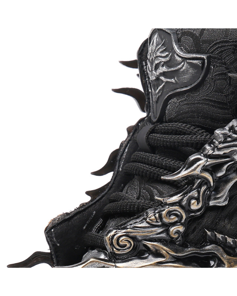 Close-up of a black and silver shoe with intricate designs on a white background