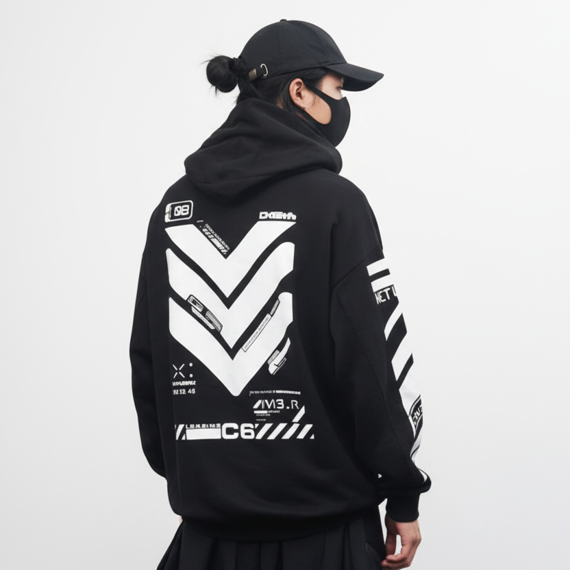 Person wearing a black hoodie with white graphics and text on the back