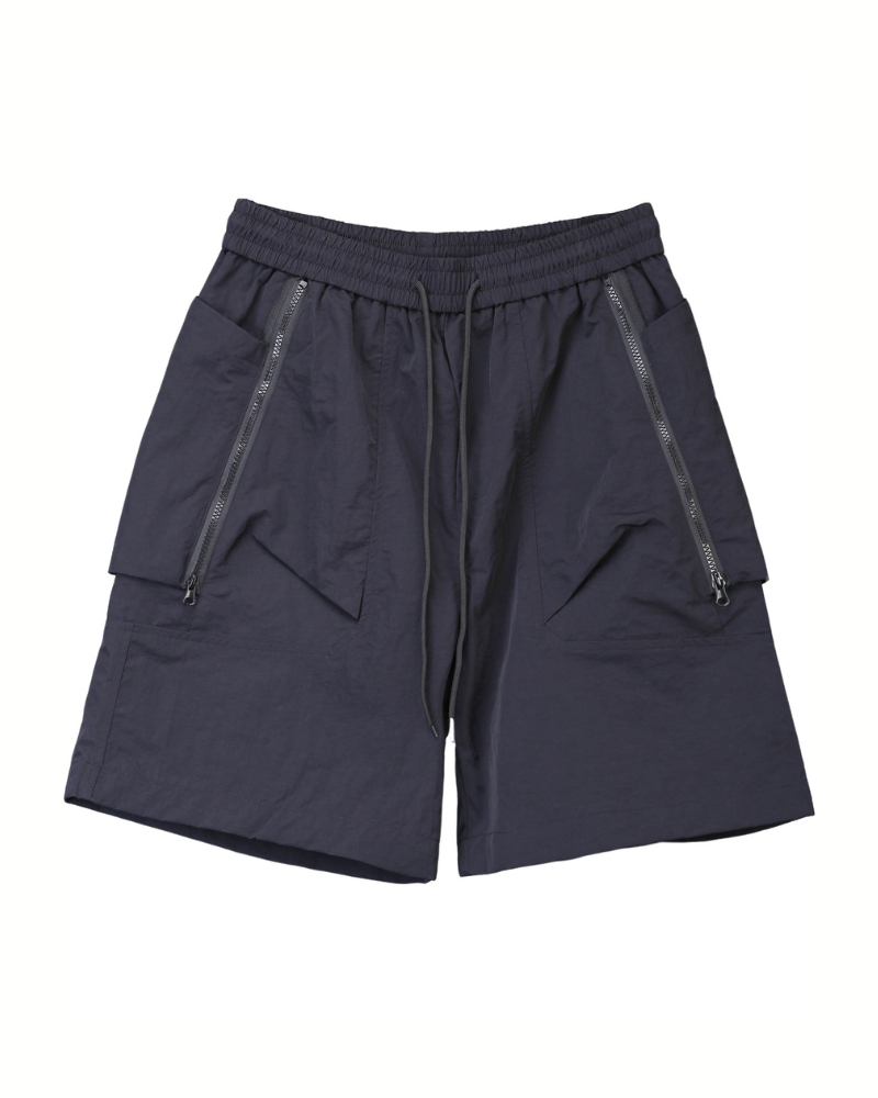 Black techwear shorts with zippers on a white background