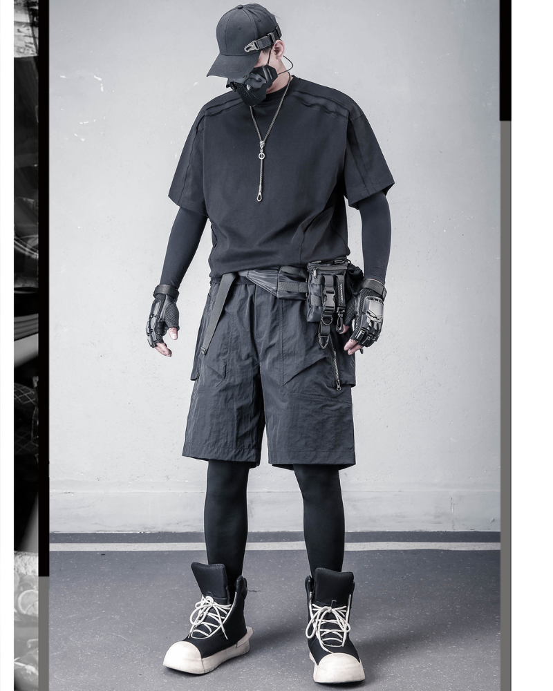Person wearing a black outfit with tactical gear in an urban setting