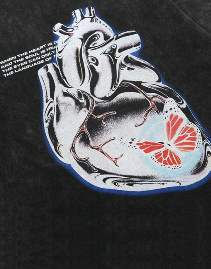 Muted grey oversized techwear t-shirt with a polished metallic heart emblem graphic and structured urban styling visible — view 2