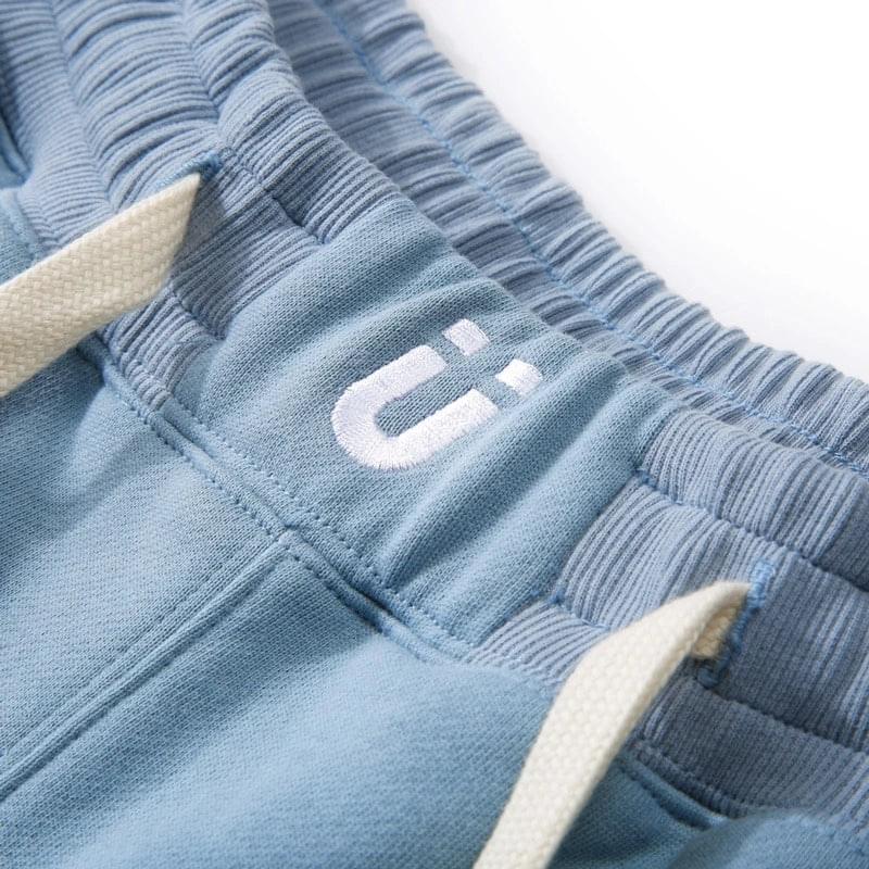 Teenager wearing light blue fake two-piece shorts with athletic shoes.