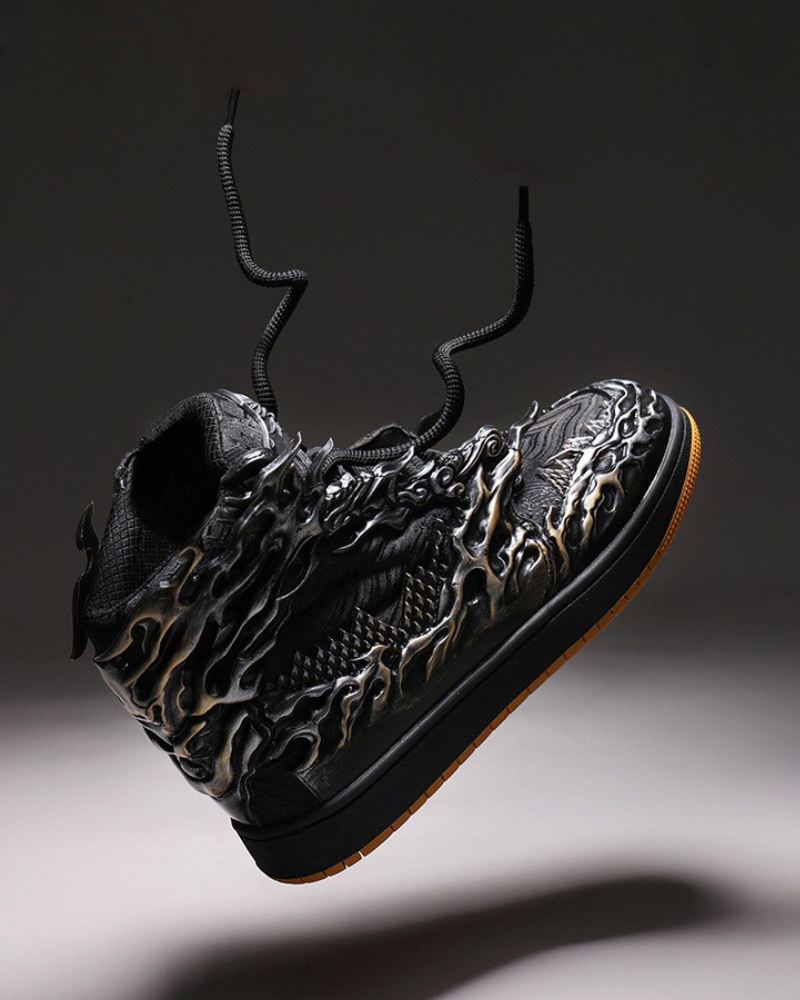 Black high-top sneaker with detailed design on a dark background