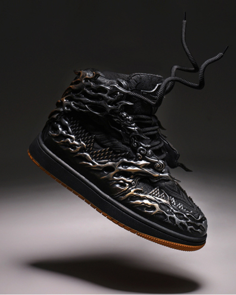 Black high-top sneaker with intricate design on a dark background