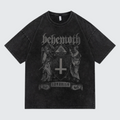 A washed black short-sleeve t-shirt featuring a dark gray gothic graphic print of the band Behemoth with their 'Shavhsis' album artwork on the front, displayed against a light gray background.