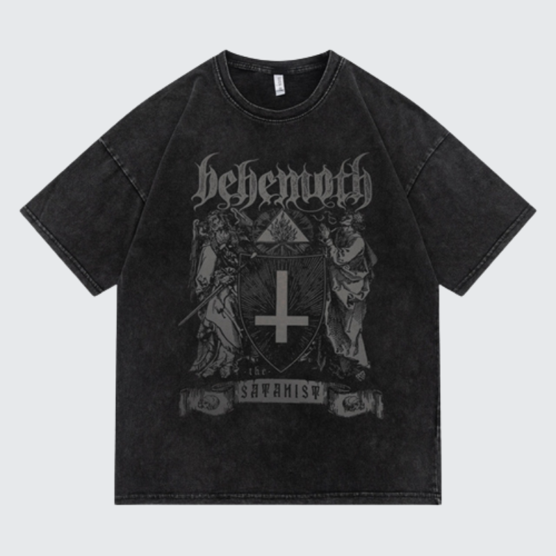 A washed black short-sleeve t-shirt featuring a dark gray gothic graphic print of the band Behemoth with their 'Shavhsis' album artwork on the front, displayed against a light gray background.