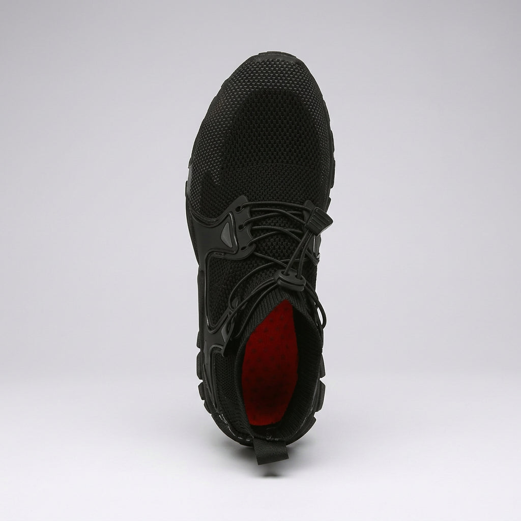 A black athletic sneaker shown from a top-down view, featuring a textured mesh upper, black laces, and a contrasting red interior lining, set against a light gray studio background. Techwear Shoes Airflow Sneakers – Flexible Mesh Trainers