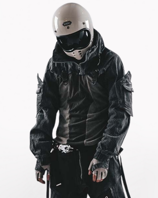 Person wearing a black motorcycle jacket and helmet on a white background