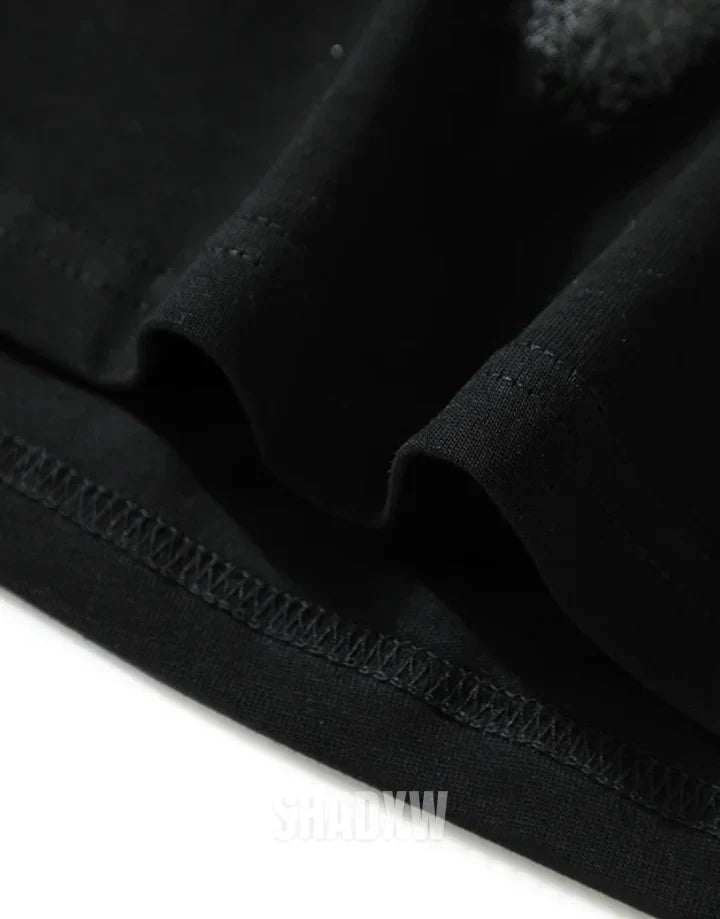 Dual-tone black and white techwear t-shirt with bold chest emblem and clean panel design for modern street layering — view 4