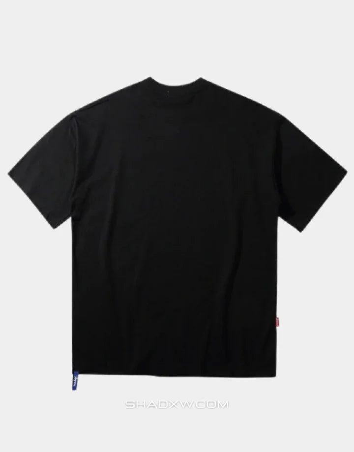 Oversized graphic techwear tee featuring a bold masked emblem and anti-conformist street style cues in contrasting tones — view 2