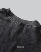 Oversized techwear t-shirt with distressed barbed-wire graphic, muted industrial palette and unisex streetwear styling — view 5