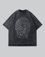 Oversized techwear t-shirt with distressed barbed-wire graphic, muted industrial palette and unisex streetwear styling — view 1