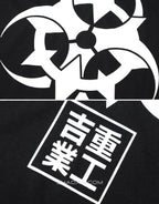 Unisex short-sleeve t-shirt shown in black and white with a prominent industrial-style emblem printed on the back for an urban graphic look — view 2