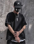 Unisex short-sleeve t-shirt shown in black and white with a prominent industrial-style emblem printed on the back for an urban graphic look — view 3