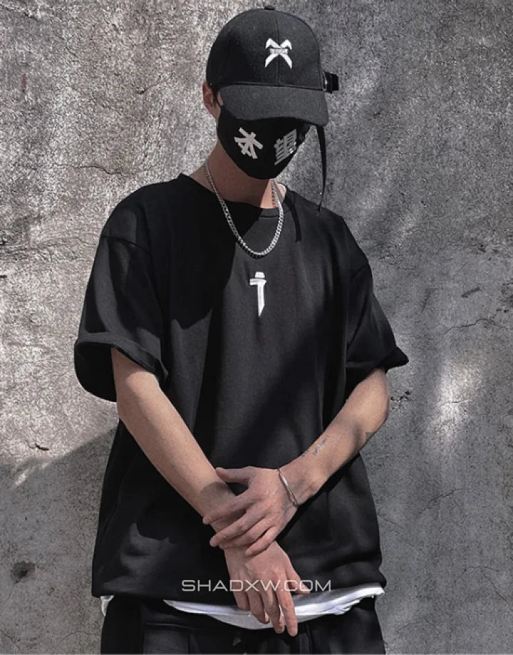 Unisex short-sleeve t-shirt shown in black and white with a prominent industrial-style emblem printed on the back for an urban graphic look — view 3