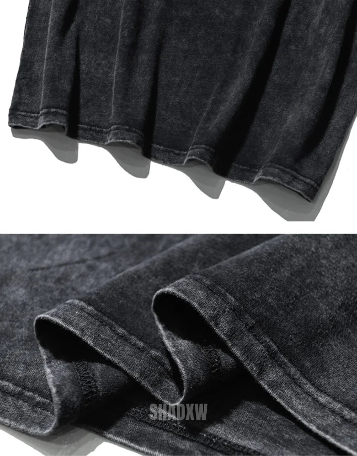 Oversized washed black techwear t-shirt with a long hem, muted charcoal finish, and minimalist urban streetwear styling — view 9