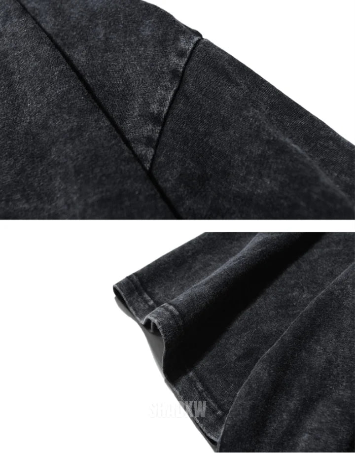 Oversized washed black techwear t-shirt with a long hem, muted charcoal finish, and minimalist urban streetwear styling — view 8