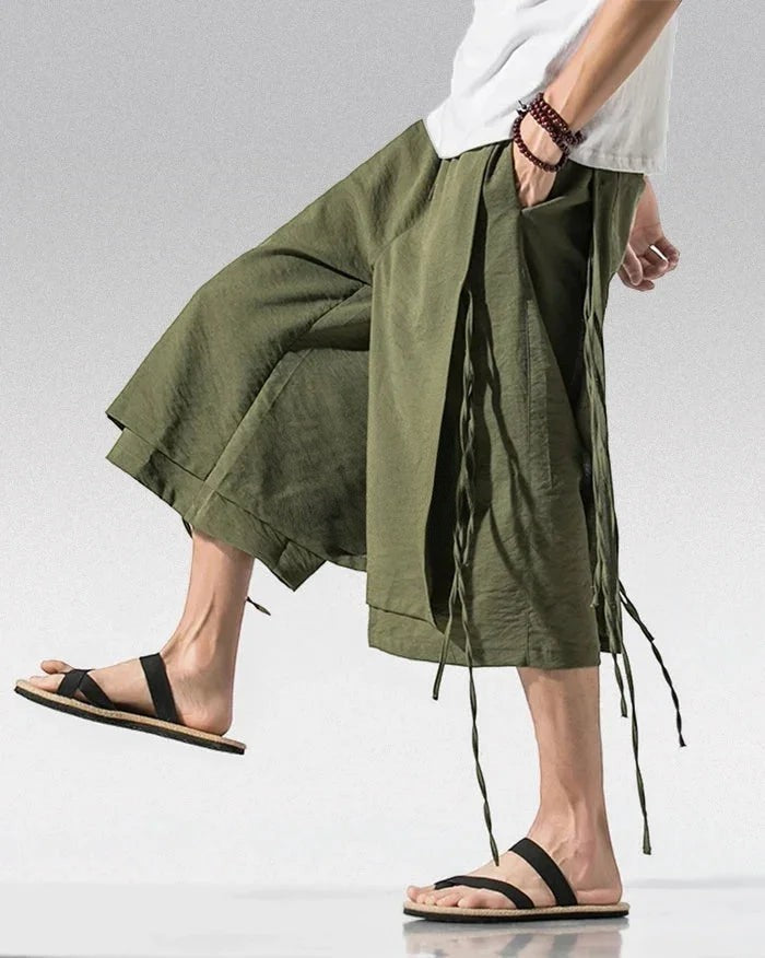 Clotechnow army green Sarouelle drape hakama pants with wide-leg silhouette and side tie details on a model