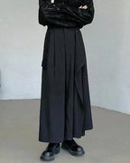 Clotechnow black asymmetric layer hakama pants with a wide-leg draped silhouette and minimalist streetwear design.