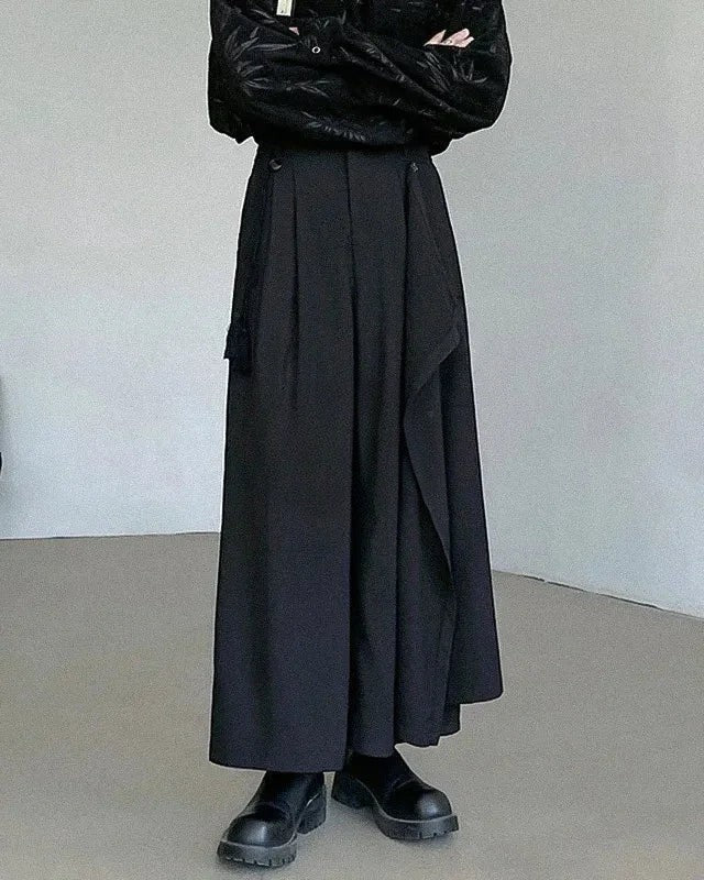Clotechnow black asymmetric layer hakama pants with a wide-leg draped silhouette and minimalist streetwear design.
