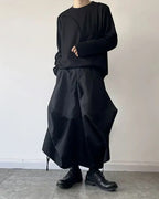 Clotechnow black baggy hakama pants with a wide-leg draped silhouette worn with a matching long-sleeve top