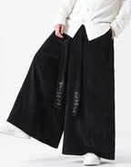 Clotechnow Harajuku volume hakama pants in black corduroy with wide-leg silhouette and embroidered tie detail