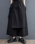 Clotechnow black double-layer hakama pants with a wide-leg silhouette, drawstring waist, and draped fabric panels.