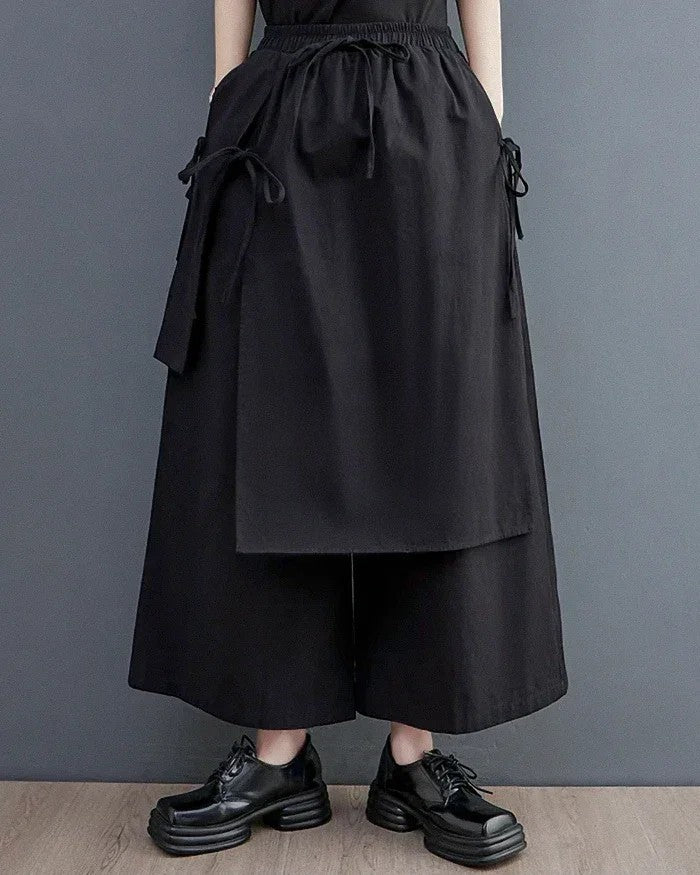 Clotechnow black double-layer hakama pants with a wide-leg silhouette, drawstring waist, and side tie details.