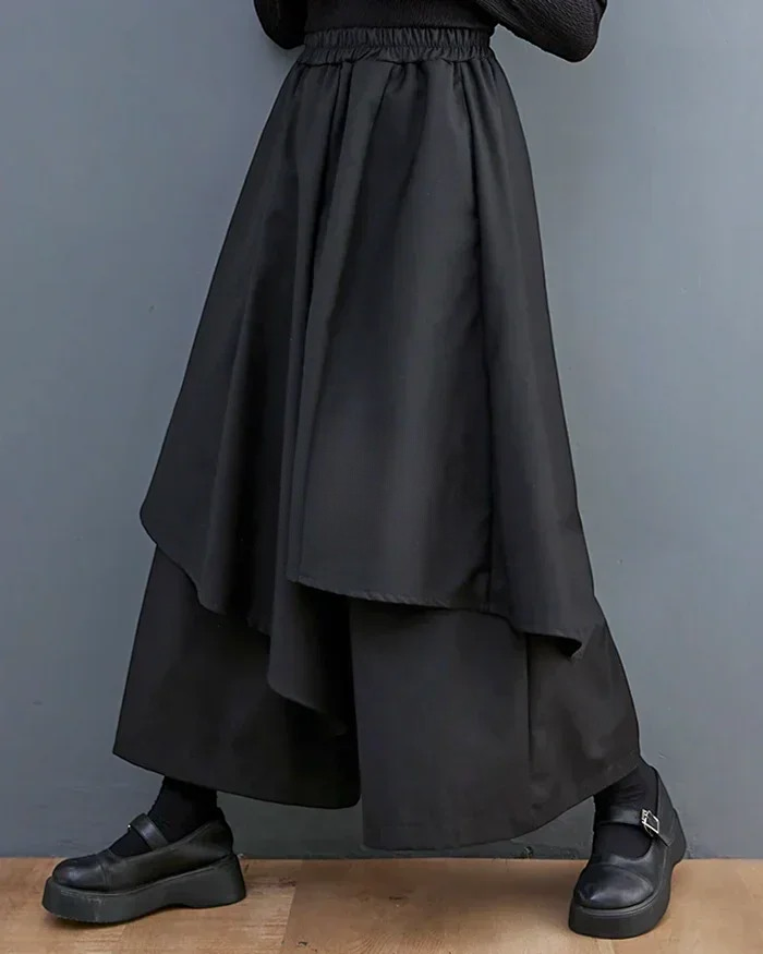 Clotechnow black formal drape hakama pants with a wide-leg silhouette and layered fabric detail.
