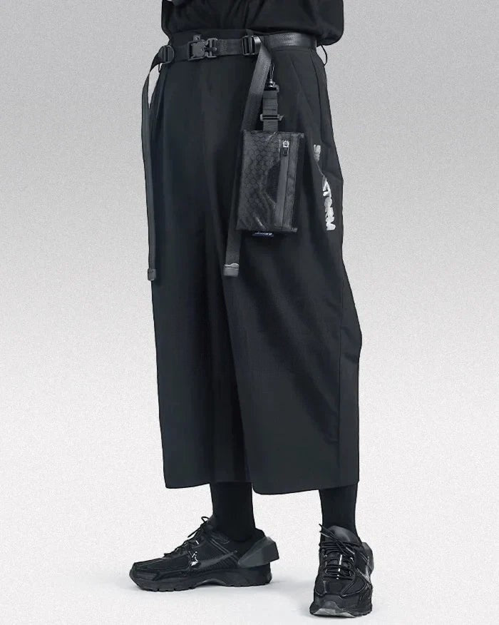 Clotechnow Ninja Motion black wide-leg hakama pants with a tactical belt and attached utility pouch