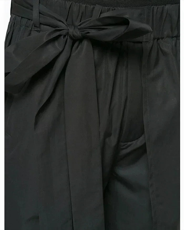 Clotechnow black short-length hakama pants featuring a wide-leg silhouette and a tied waist detail.