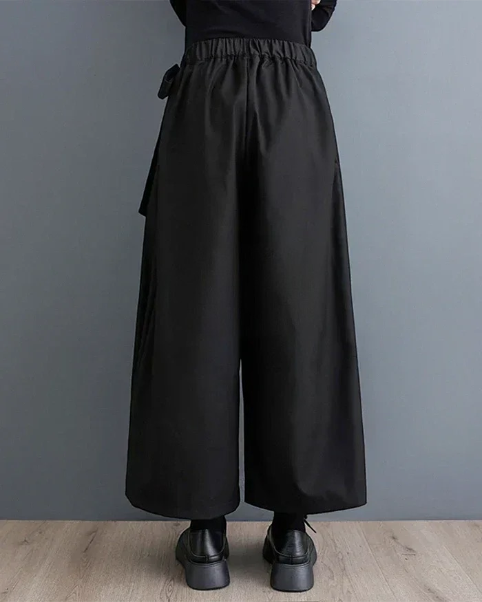 Clotechnow Eclipse Silhouette black hakama pants with wide-leg drape and elasticated waist, back view.