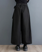 Clotechnow Eclipse Silhouette black hakama pants with wide-leg drape and elasticated waist, back view.