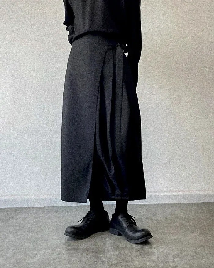 Clotechnow black kimono cut hakama pants with a wide-leg silhouette and wrap-around waist tie design.