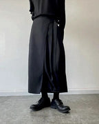 Clotechnow black kimono cut hakama pants with a wide-leg silhouette and wrap-around waist tie design.
