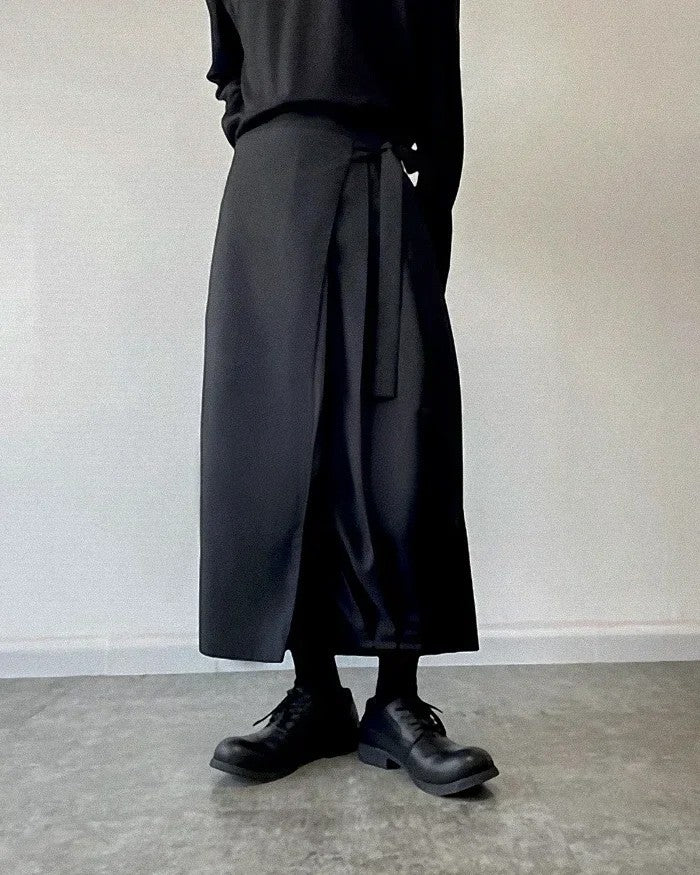 Clotechnow black kimono cut hakama pants with a wide-leg draped silhouette and wrap-style front detail.