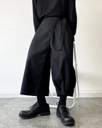 Clotechnow black kimono cut hakama pants with a wide-leg draped silhouette and tie-waist detail on a model
