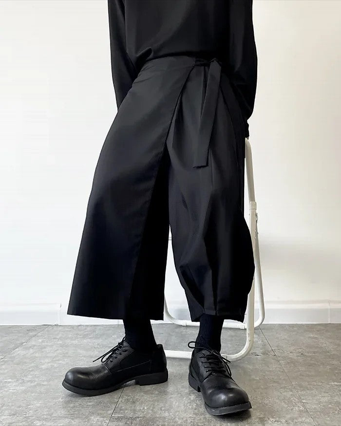 Clotechnow black kimono cut hakama pants with a wide-leg draped silhouette and tie-waist detail on a model