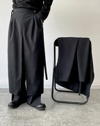 Clotechnow modular black hakama pants featuring a layered skirt-like design and wide-leg silhouette