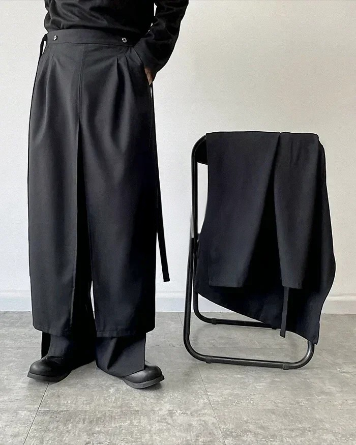 Clotechnow modular black hakama pants featuring a layered skirt-like design and wide-leg silhouette